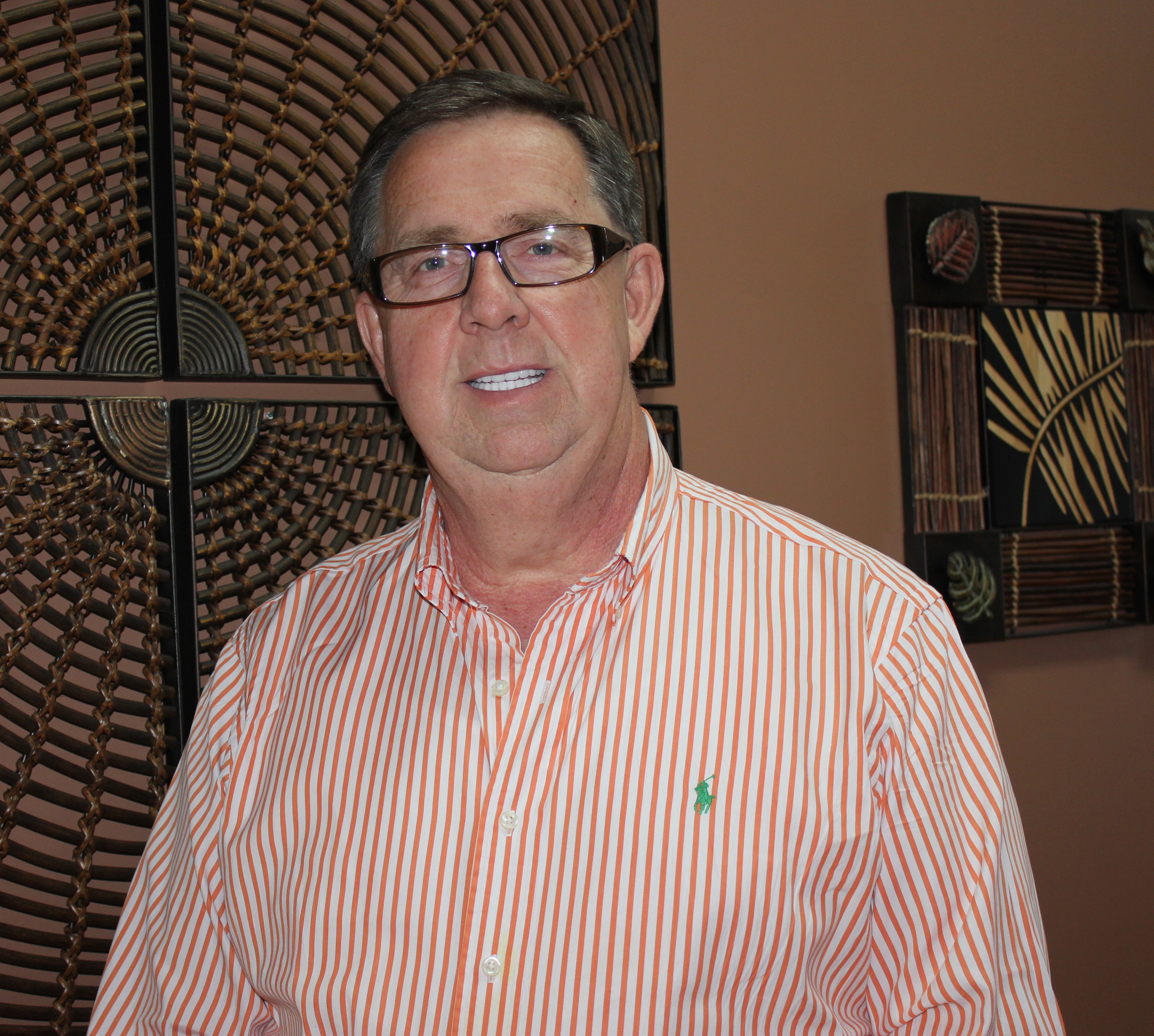 Shown is an image of a white male with glasses
